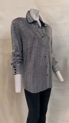 an image of a mannequin wearing a black and white shirt and leggings