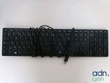 a black keyboard with a cord attached to it