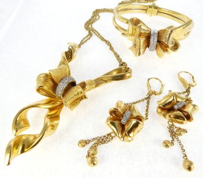 three pieces of jewelry including a necklace, bracelet, and ring
