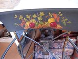 a boat that has been painted with fruit on it