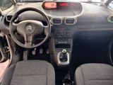 a picture of a car dashboard with a clock on it