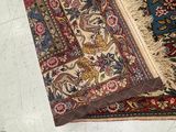 a cat that is laying on a rug on the floor