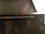 a microwave oven sitting on top of a wooden table