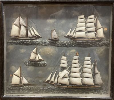 a picture of a picture of a group of sailboats in the water