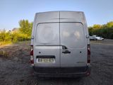 a silver van that is parked in a parking lot