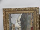 a picture of a painting of a street scene in a gold frame