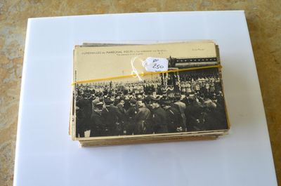 an old photo of a group of people standing in front of a crowd