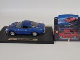 the blue car is next to the red car in the box