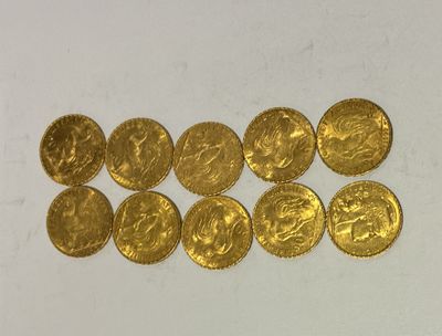 a bunch of gold coins sitting on top of a white surface