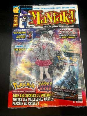 a close up of a magazine on a black surface