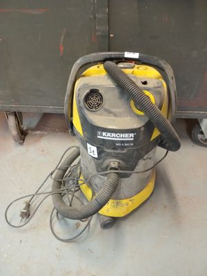 a vacuum that is sitting on the floor in the room