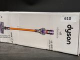 boxed box of a cordless vacuum cleaner sitting on top of a table