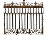 a close up of a wrought iron gate with a bird on top
