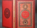 a red book with gold trimming and a red cover