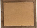 an old wooden frame with a cork board attached to it