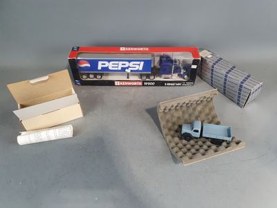 a box of pepsi soda sitting on a table next to a box of eggs