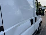 a white van that is parked in a parking lot