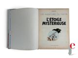 an open book with a picture of a train on it