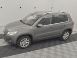 a picture of a grey car parked in a garage