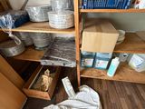 a wooden shelf with many items on it in a room