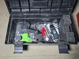 a tool box with tools inside of it on the floor