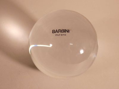 a glass ball that is sitting on a table