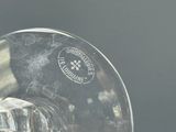 a clear glass with a black and white picture on it