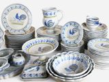 a lot of plates and cups on the table