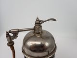 a silver metal coffee grinder with a wooden handle
