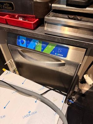 an image of a stainless steel dishwasher with a hose attached to it