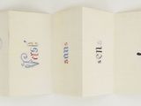 a picture of a folded book with drawings on it