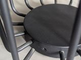 a black chair that is sitting on the floor
