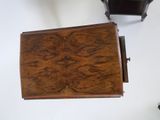 a small wooden table with a drawer underneath it
