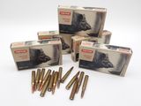 three boxes of ammo cartridges are sitting on a white surface