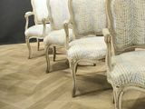 four chairs that are lined up in a row