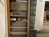 a tall wooden shelf with glass shelves in the middle of a room