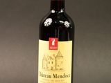 a bottle of wine that is sitting on a table