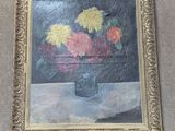 a painting of flowers in a vase on the wall