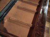 a piano that is sitting in the middle of a table