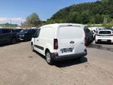 a white van that is parked in a parking lot