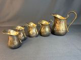 five antique silverplated pitchers and a pitcher