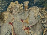 a tapestry with a picture of a man riding a cow