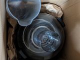 a box with two empty plastic cups inside of it
