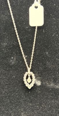 a close up of a necklace with a tag attached to it