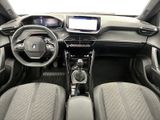 the interior of a car with a steering wheel, dashboard, and dashboard controls