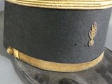 a black hat with a gold band and a black hat with a gold band