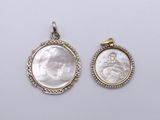 a pair of mother of pearl and diamond pendants