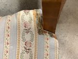 a piece of fabric that has been torn off of the back of a chair