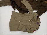 an image of a pair of military uniforms sitting on a table