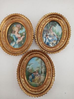 three framed pictures of a woman and a child in a landscape